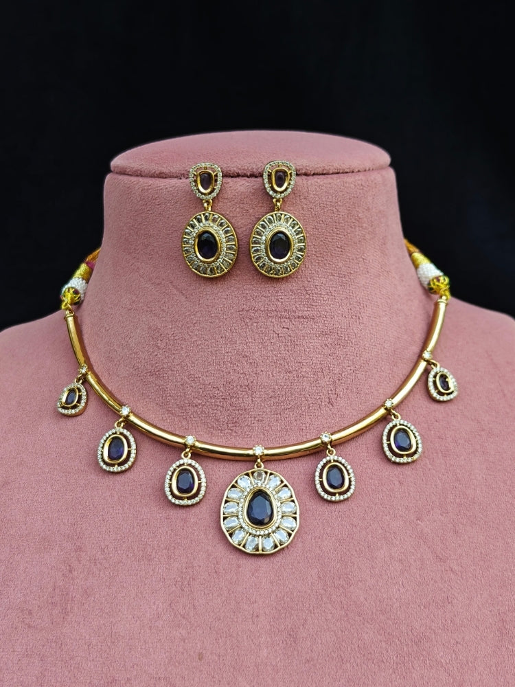 Close-up of an ornate Indo-western Purple (Dull gold) Hasli Diamond jewellery set and earrings with American Diamond and Colored Stones. Wedding guest wearing a sparkling American diamond necklace with a saree.
Close-up shot of a high-quality American diamond artificial necklace worn for festive celebrations.