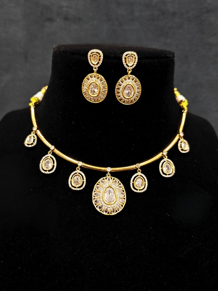 Close-up of an ornate Indo-western White (Dull gold) Hasli Diamond jewellery set and earrings with American Diamond. Wedding guest wearing a sparkling American diamond necklace with a saree.
Close-up shot of a high-quality American diamond artificial necklace worn for festive celebrations.