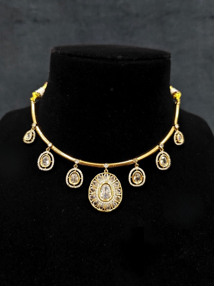 Close-up of an ornate Indo-western White (Dull gold) Hasli Diamond jewellery set and earrings with American Diamond. Wedding guest wearing a sparkling American diamond necklace with a saree.
Close-up shot of a high-quality American diamond artificial necklace worn for festive celebrations.