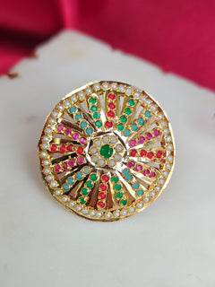 Close-up of an ornate traditional (Gold Polish) Multi-Color Ring with Colored Stone and Pearl. Mehendi function outfit styled with a lightweight Jadau Ring. Festive celebration look featuring a Jadau artificial Ring.