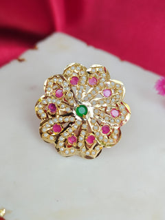 Close-up of an ornate traditional (Gold Polish) Multi-Color Ring with Colored Stone and Pearl. Mehendi function outfit styled with a lightweight Jadau Ring. Festive celebration look featuring a Jadau artificial Ring.