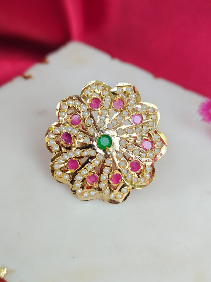Close-up of an ornate traditional (Gold Polish) Multi-Color Ring with Colored Stone and Pearl. Mehendi function outfit styled with a lightweight Jadau Ring. Festive celebration look featuring a Jadau artificial Ring.