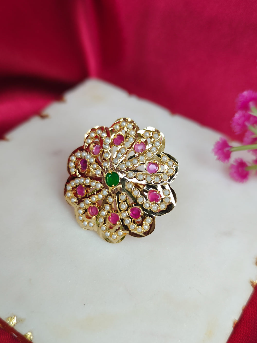 Close-up of an ornate traditional (Gold Polish) Multi-Color Ring with Colored Stone and Pearl. Mehendi function outfit styled with a lightweight Jadau Ring. Festive celebration look featuring a Jadau artificial Ring.