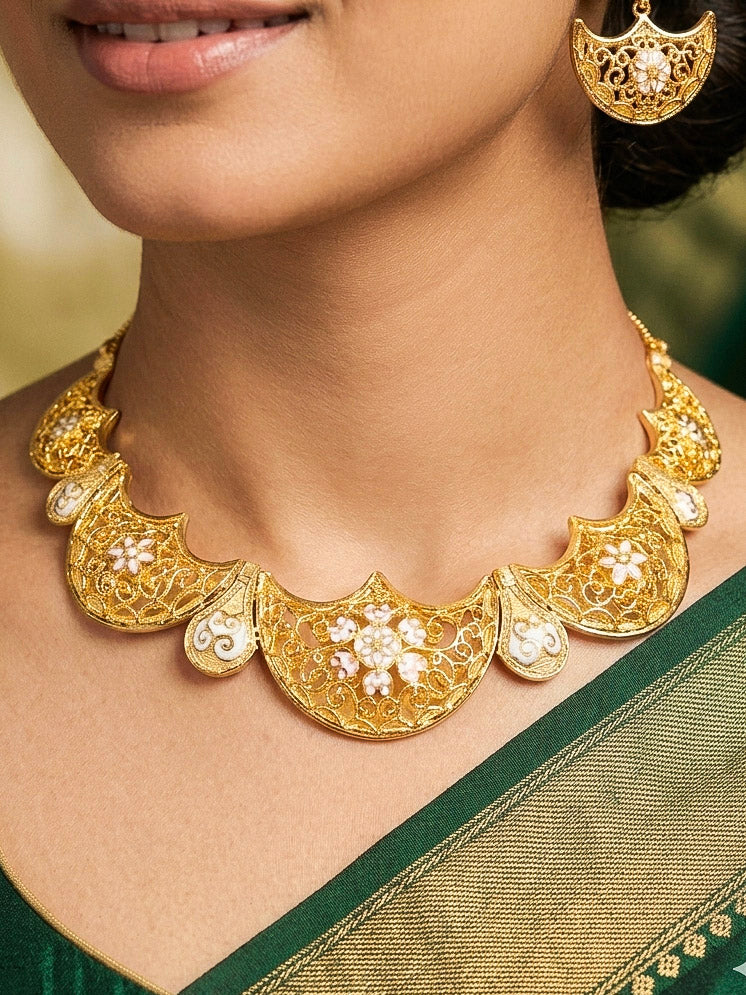 Close-up of a woman wearing an ornate traditional Meenakari gold Collar jewellery set and earrings with Filigree Work and Meenakari. Festive celebration look enhanced with traditional Meenakari jewelry. Close-up of detailed enamel craftsmanship in Meenakari jewelry.