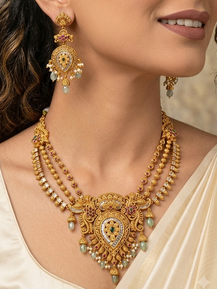 Close-up of a women wearing an ornate traditional (Gold Polish) Collar jewellery set and earrings with American Diamond, Tumble Beads and Polki. Woman wearing a luxury artificial American Diamond jewelry set styled for an Indian wedding celebration. Traditional Indian bridal look featuring a premium imitation American Diamond jewelry set.