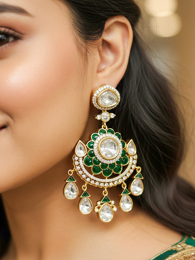 Close-up of a woman wearing an ornate traditional (Bright Gold) Green Collar jewellery set and earrings and maangtikka with Green Colored Stones, American Diamond, Pearls and Moissanite. Reception night styling featuring sparkling imitation Moissanite jewelry Set. Bride wearing a high-quality artificial Moissanite jewelry set for wedding rituals.