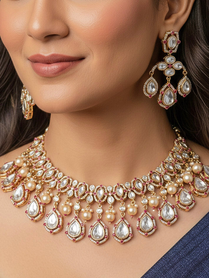Close-up of a woman wearing an ornate traditional (Bright Gold) Pink Collar jewellery set and earrings and maangtikka with Kundan, Pink Colored Stones, American Diamond and Pearls. Bridal photoshoot look styled with a luxury imitation Moissanite jewelry set. Woman wearing Luxury artificial Moissanite jewelry for a grand celebration.
