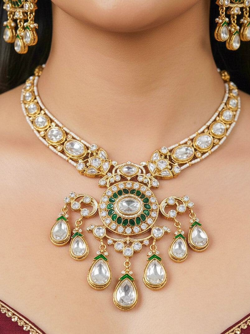 Close-up of a woman wearing an ornate traditional (Bright Gold) Green Collar jewellery set and earrings and maangtikka with Green Colored Stones, Kundan, American Diamond and Pearls. Woman wearing trending artificial Moissanite jewelry for wedding season in India. Bride wearing a high-quality artificial Moissanite jewelry set for wedding rituals.