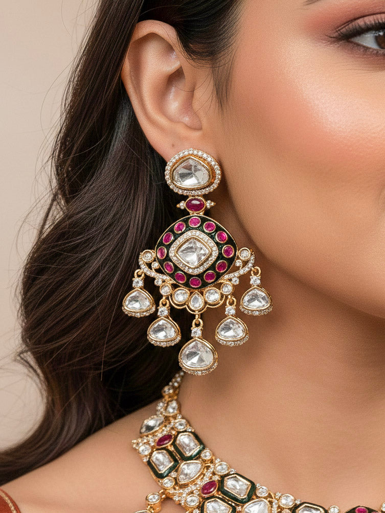 Close-up of a woman wearing an ornate traditional Meenakari Green and Pink Collar jewellery set and earrings and maangtikka with Pink Colored Stones, Uncut Kundan, American Diamond and Meenakari. Bride wearing a colorful Meenakari artificial necklace set for her wedding ceremony. Close-up of intricate Meenakari detailing in imitation bridal jewelry.