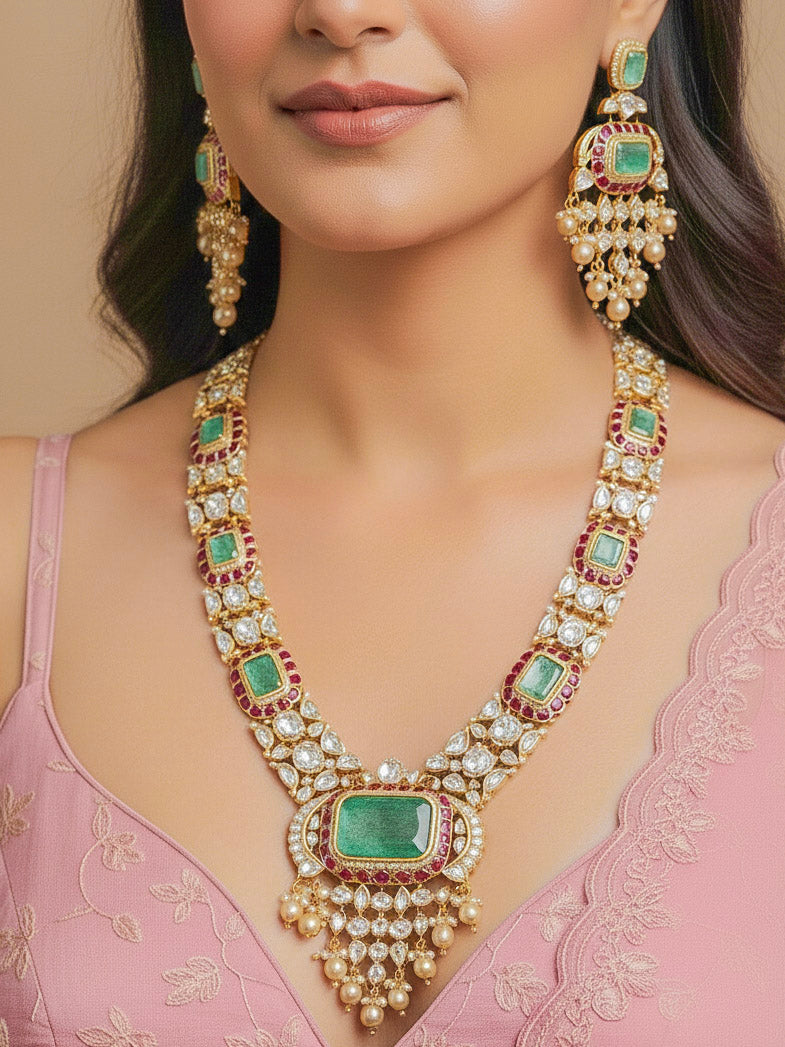 Close-up of a woman wearing an ornate traditional (Bright Gold) Mint Green and Ruby Pink jewellery set and earrings and maangtikka with American Diamond, Pink Colored Stones, Uncut Kundan, Pearls and Doublet Stone. Bride showcasing a premium imitation Moissanite  jewelry set for her reception look. Elegant Indian wedding look completed with luxury artificial  moissanite jewelry set. 
