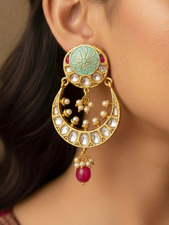 Close-up of a woman wearing an ornate traditional Mint Green Kundan gold Earrings with Pearls, Kundan and Meenakari. Festive saree look completed with premium imitation Kundan earrings. Perfect Kundan Earring set for weddings and festivals.