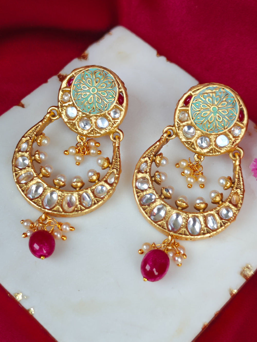 Close-up of a woman wearing an ornate traditional Mint Green Meenakari gold Earrings with Pearls, Kundan and Meenakari. Festive saree look completed with premium imitation Meenakari earrings. Perfect Meenakari Earring set for weddings and festivals.