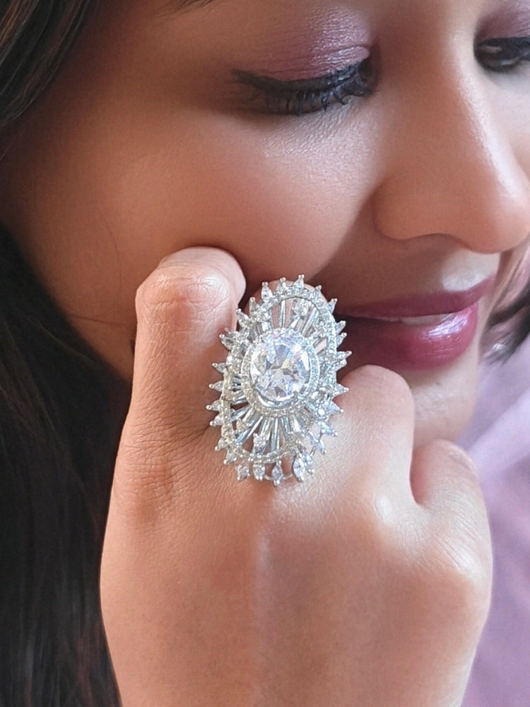 Close-up of a woman wearing an ornate Western (Silver Polish) Diamond Ring with American Diamond. Cocktail party outfit paired with sparkling artificial American Diamond Ring. Close-up of American diamond Ring styled for a reception party.