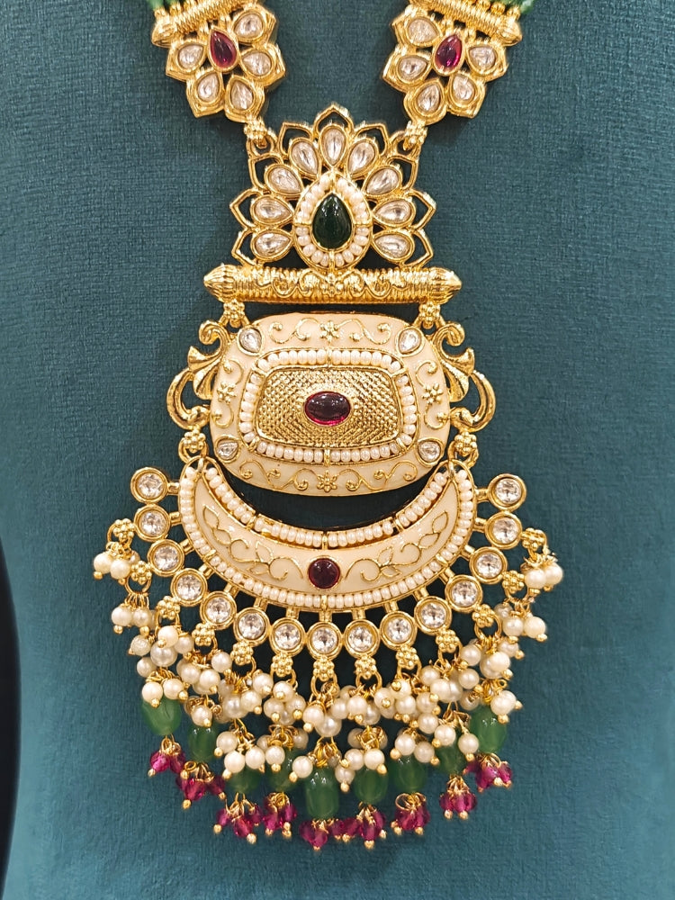 Close-up of an ornate traditional Mint Green Rajwadi gold Long jewellery set and earrings with Pearls, Tumble Beads, Meenakari, Hydro Crystal, Bandhai Work. Reception party look featuring a statement Rajwadi necklace. Luxury imitation Rajwadi necklace worn for wedding celebrations.