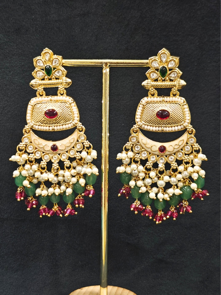 Close-up of an ornate traditional Mint Green Rajwadi gold Long jewellery set and earrings with Pearls, Tumble Beads, Meenakari, Hydro Crystal, Bandhai Work. Reception party look featuring a statement Rajwadi necklace. Luxury imitation Rajwadi necklace worn for wedding celebrations.