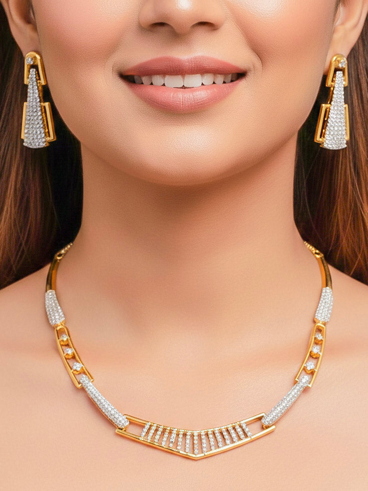 Close-up of a woman wearing an ornate Indo-western gold & White Collar jewellery set and earrings with American Diamond. A woman wearing a luxury American diamond necklace set styled beautifully for a wedding guest look in India. Model wearing a lightweight American diamond necklace perfect for long wedding functions.