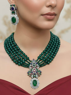 Close-up of a woman wearing an ornate traditional Green Collar jewellery set and earrings with American Diamond, Colored Stones and Green Beads. Mehendi ceremony styling featuring a premium Colored Stones artificial jewelry piece.
Close-up of a featuring an anti-tarnish Colored Stones artificial necklace.