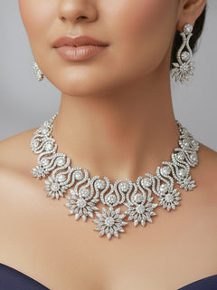 Woman wearing the Vista American Diamond necklace set with earrings and maangtikka