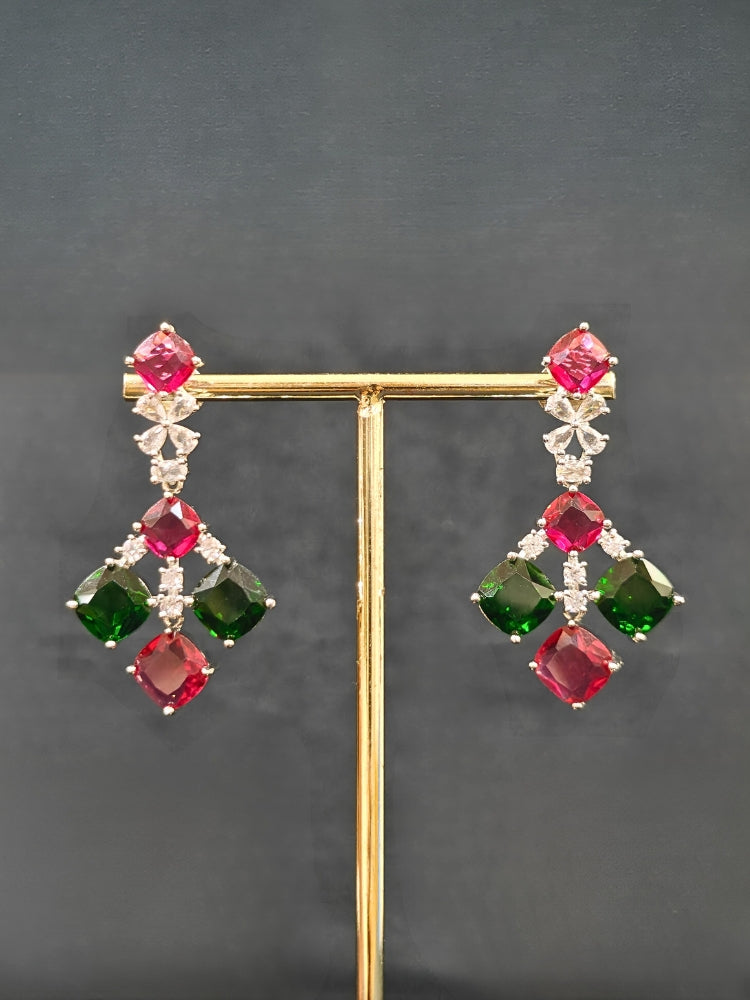 An exquisite artificial diamond and red and green colored stone necklace and matching earrings, designed for the perfect engagement look. This stunning artificial diamond jewelry set offers luxury and sophistication while being an affordable alternative to natural diamonds.