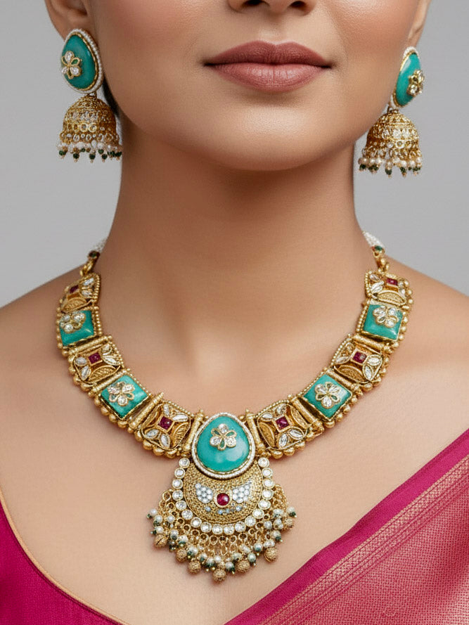 Close-up of a woman wearing an ornate traditional Mint Green Heritage gold Collar jewellery set and earrings with Mint Green Colored Stones, Kundan and Pearls. Woman styling a vintage heritage artificial necklace for a reception party. Perfect  Heritage necklace set for weddings and festivals.
