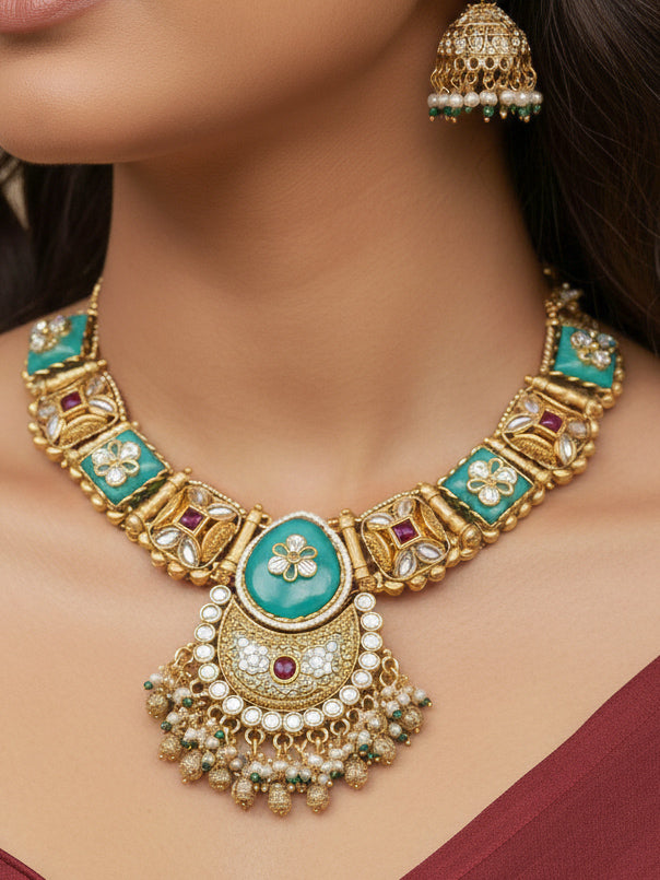 Close-up of a woman wearing an ornate traditional Mint Green Heritage gold Collar jewellery set and earrings with Mint Green Colored Stones, Kundan and Pearls. Woman styling a vintage heritage artificial necklace for a reception party. Perfect  Heritage necklace set for weddings and festivals.