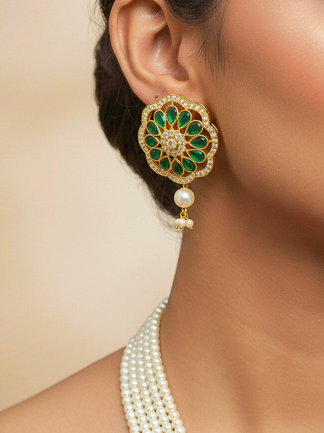 Close-up of a woman wearing an ornate traditional (Gold Polish) White Long Jewellery Set and Earrings with Colored Stones, Pearl and American Dimaonds.  Wedding guest wearing a lightweight Kundan necklace for a Wedding function. Woman wearing trending Pearl artificial jewelry for wedding season in India.