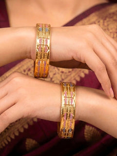 Close-up of an a women wearing ornate traditional (Gold Polish) Bangles Set. It’s comfortable and lightweight enough for everyday wear, and it also looks absolutely beautiful and elegant. The design is stylish, the finish is impressive, and it feels really pleasant to wear all day.