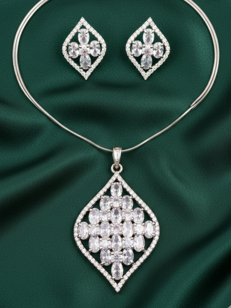 Close-up of a woman wearing an ornate Western (Silver Polish) Diamond Pendant Set with American Diamond. Close-up of a cocktail party look featuring a premium American diamond Pendant. Party wear outfit completed with a lightweight American diamond Pendant.