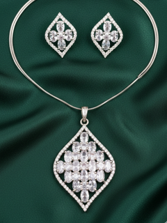 Close-up of a woman wearing an ornate Western (Silver Polish) Diamond Pendant Set with American Diamond. Close-up of a cocktail party look featuring a premium American diamond Pendant. Party wear outfit completed with a lightweight American diamond Pendant.