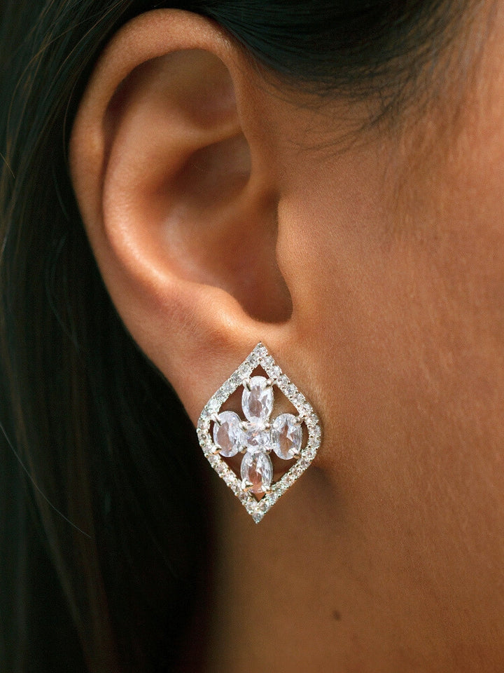 Close-up of a woman wearing an ornate Western (Silver Polish) Diamond Pendant Set with American Diamond. Close-up of a cocktail party look featuring a premium American diamond Pendant. Party wear outfit completed with a lightweight American diamond Pendant.