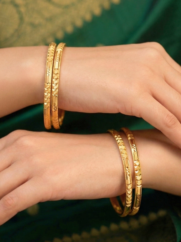 Close-up of an a women wearing ornate traditional (Gold Polish) Bangles Set. It’s comfortable and lightweight enough for everyday wear, and it also looks absolutely beautiful and elegant. The design is stylish, the finish is impressive, and it feels really pleasant to wear all day.
