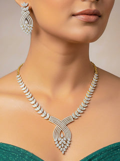 Close-up of a women wearing an ornate Western American Diamond Gold Collar jewellery set and earrings with American Diamond. Close-up of a featuring an anti-tarnish American diamond artificial necklace. A luxury American diamond necklace set styled beautifully for a wedding guest look in India.