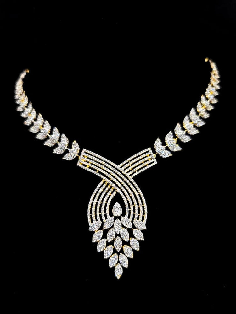 Close-up of an ornate Western American Diamond Gold Collar jewellery set and earrings with American Diamond. Close-up of a featuring an anti-tarnish American diamond artificial necklace. A luxury American diamond necklace set styled beautifully for a wedding guest look in India.