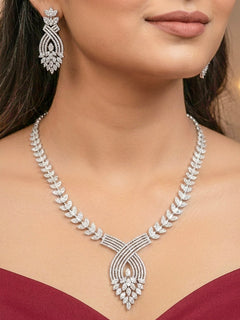 "Elegant woman wearing a luxurious artificial diamond necklace with matching  earrings, perfect for high-profile wedding receptions and formal galas. This high-end artificial diamond jewelry set combines style, elegance, and affordability for special occasions."