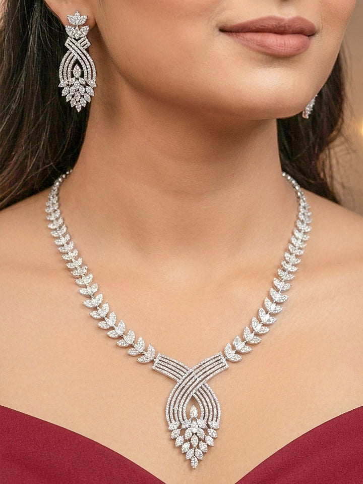 "Elegant woman wearing a luxurious artificial diamond necklace with matching  earrings, perfect for high-profile wedding receptions and formal galas. This high-end artificial diamond jewelry set combines style, elegance, and affordability for special occasions."
