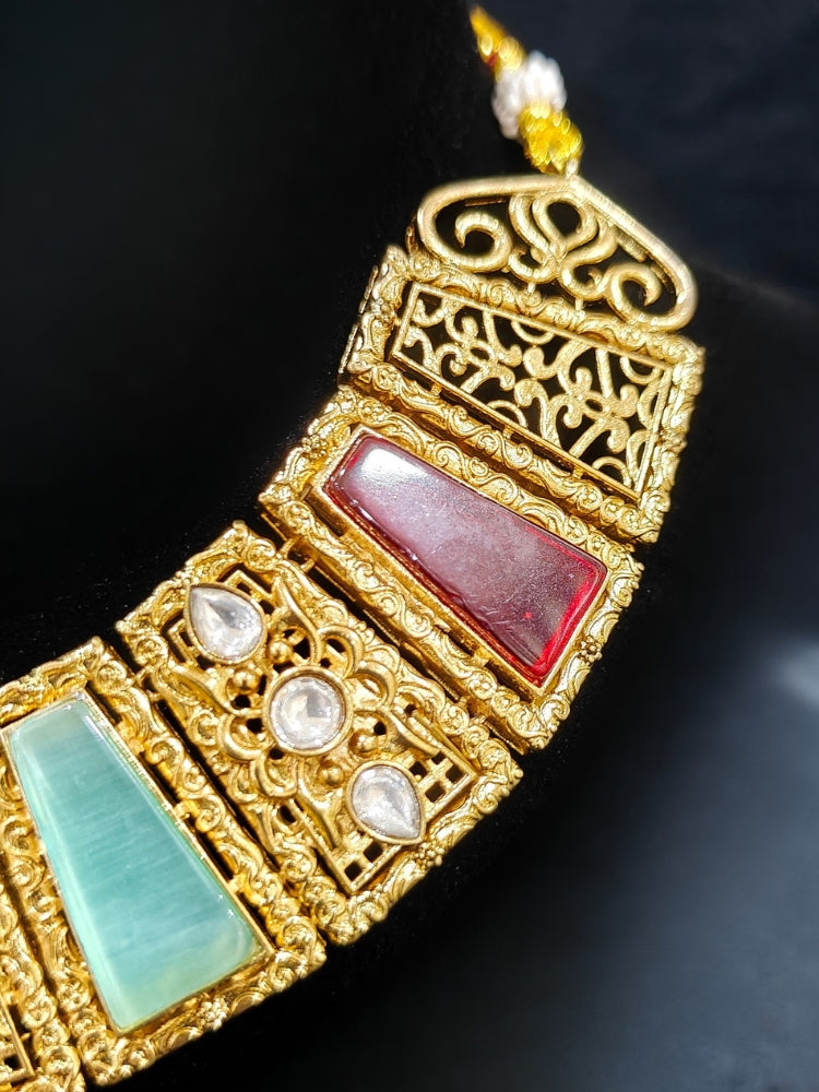 A glamorous artificial diamond and multi colored stone amrapali necklace paired with chic earrings, perfect for bridal wear. This high-quality artificial diamond jewelry set is the ideal choice for modern brides looking for a budget-friendly option with timeless sparkle.