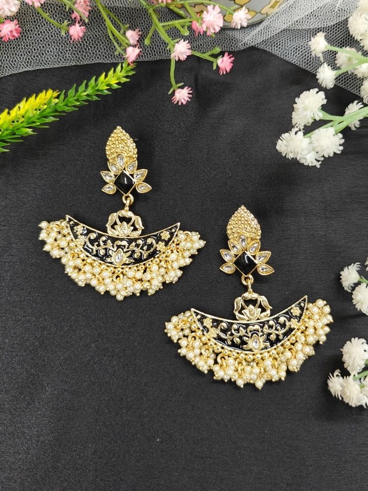 Close-up of an ornate traditional Black Meenakari gold Earrings with Pearls, Kundan and Meenakari. Reception party styling featuring a premium Meenakari imitation Earring. Perfect Earrings for weddings and festivals.