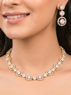 Woman wearing the Zorah bright gold American Diamond collar necklace set