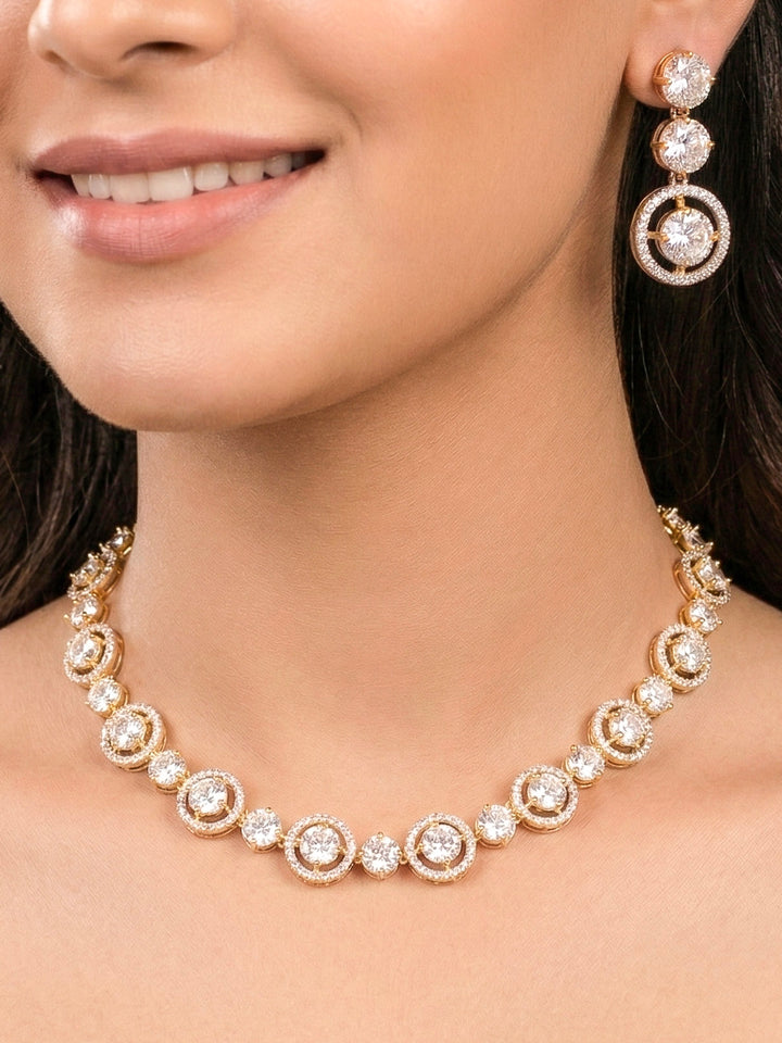 Close-up of a woman wearing an ornate Indo-western Diamond gold Collar jewellery set and earrings with American Diamond. Close-up of a cocktail party look featuring a premium American diamond necklace. Perfect American Diamond necklace set for Parties and festivals.