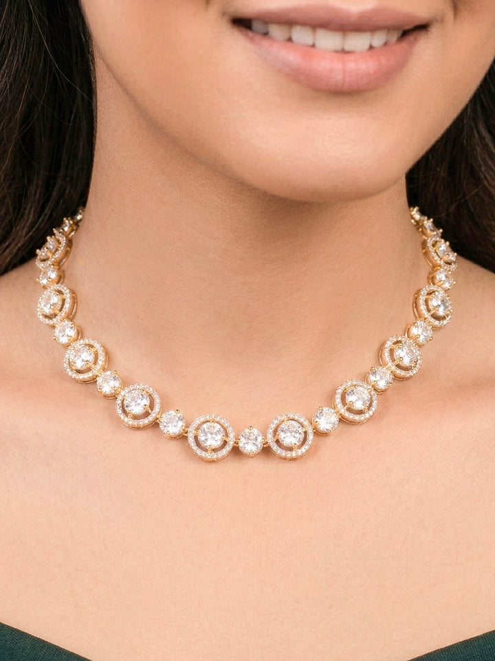 Close-up of a woman wearing an ornate Indo-western Diamond gold Collar jewellery set and earrings with American Diamond. Close-up of a cocktail party look featuring a premium American diamond necklace. Perfect American Diamond necklace set for Parties and festivals.