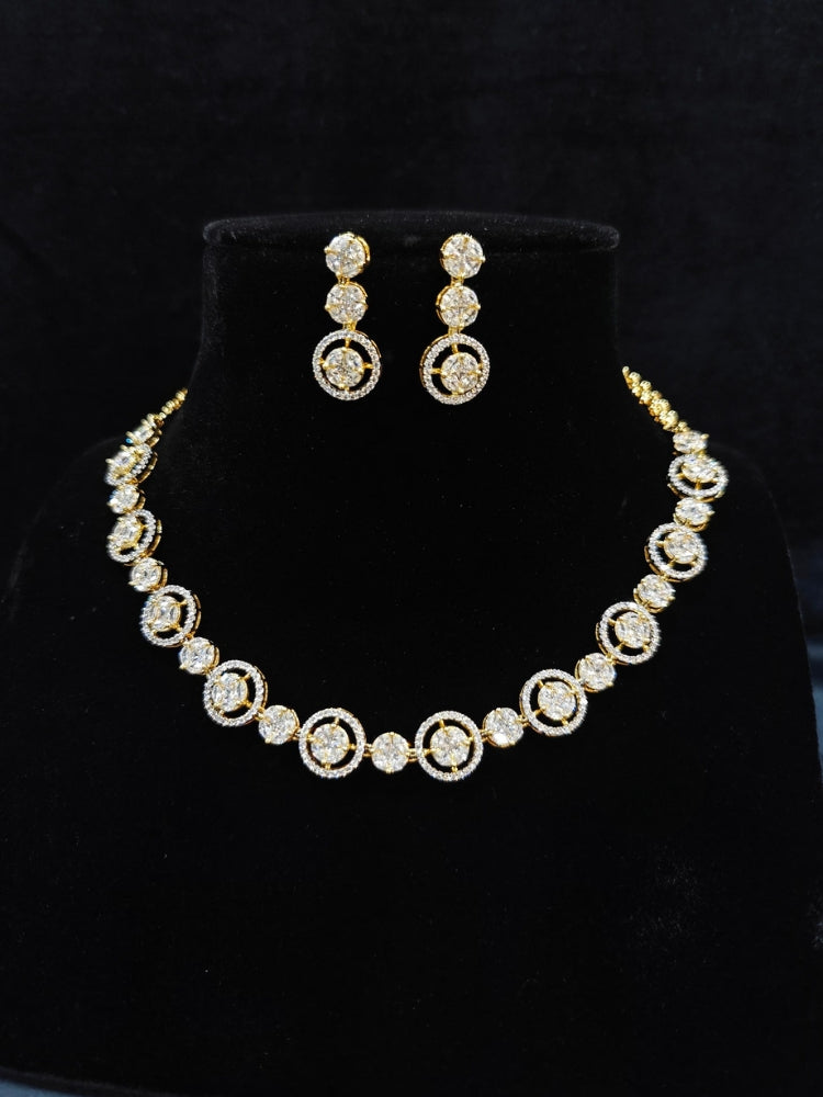 Close-up of an ornate Indo-western Diamond gold Collar jewellery set and earrings with American Diamond. Close-up of a cocktail party look featuring a premium American diamond necklace. Perfect American Diamond necklace set for Parties and festivals.