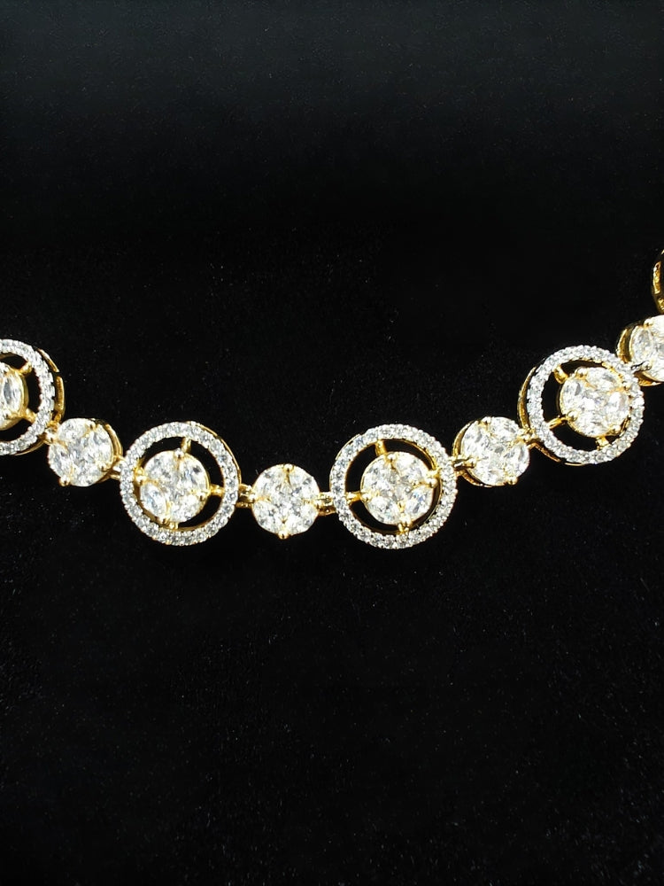 Close-up of an ornate Indo-western Diamond gold Collar jewellery set and earrings with American Diamond. Close-up of a cocktail party look featuring a premium American diamond necklace. Perfect American Diamond necklace set for Parties and festivals.
