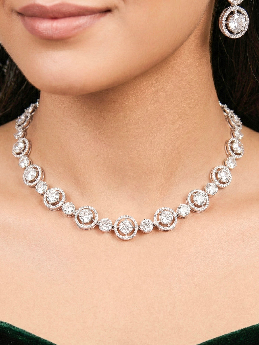 Close-up of a woman wearing an ornate Indo-western Diamond Silver Collar jewellery set and earrings with American Diamond. Close-up of a cocktail party look featuring a premium American diamond necklace. Perfect American Diamond necklace set for Parties and festivals.