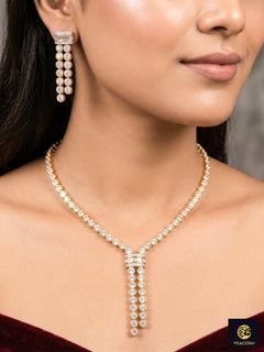Close-up of a woman wearing an ornate Western Diamond gold Collar jewellery set and earrings with American Diamond. A graceful woman wearing a trending American diamond necklace for a 2026 Reception celebration. Close-up of a cocktail party look featuring a premium American diamond necklace.