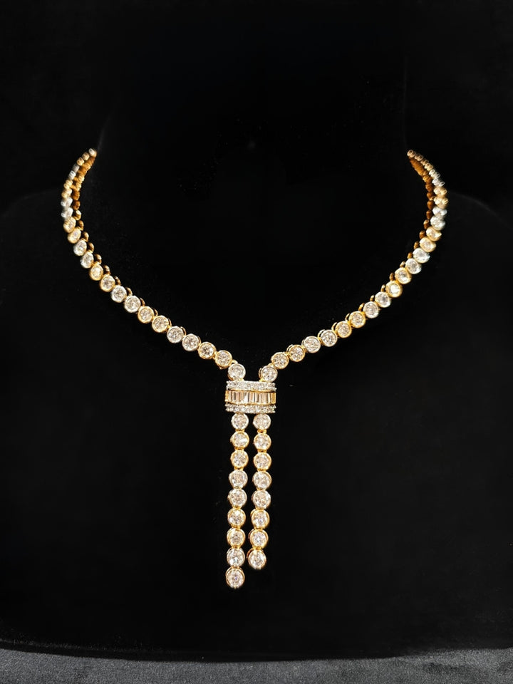 Close-up of an ornate Western Diamond gold Collar jewellery set and earrings with American Diamond. A trending American diamond necklace for a 2026 Reception celebration. Close-up of a cocktail party look featuring a premium American diamond necklace.