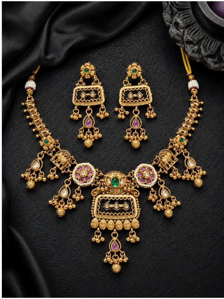 Heritage necklace set with green kemp stone and matching earrings on black satin