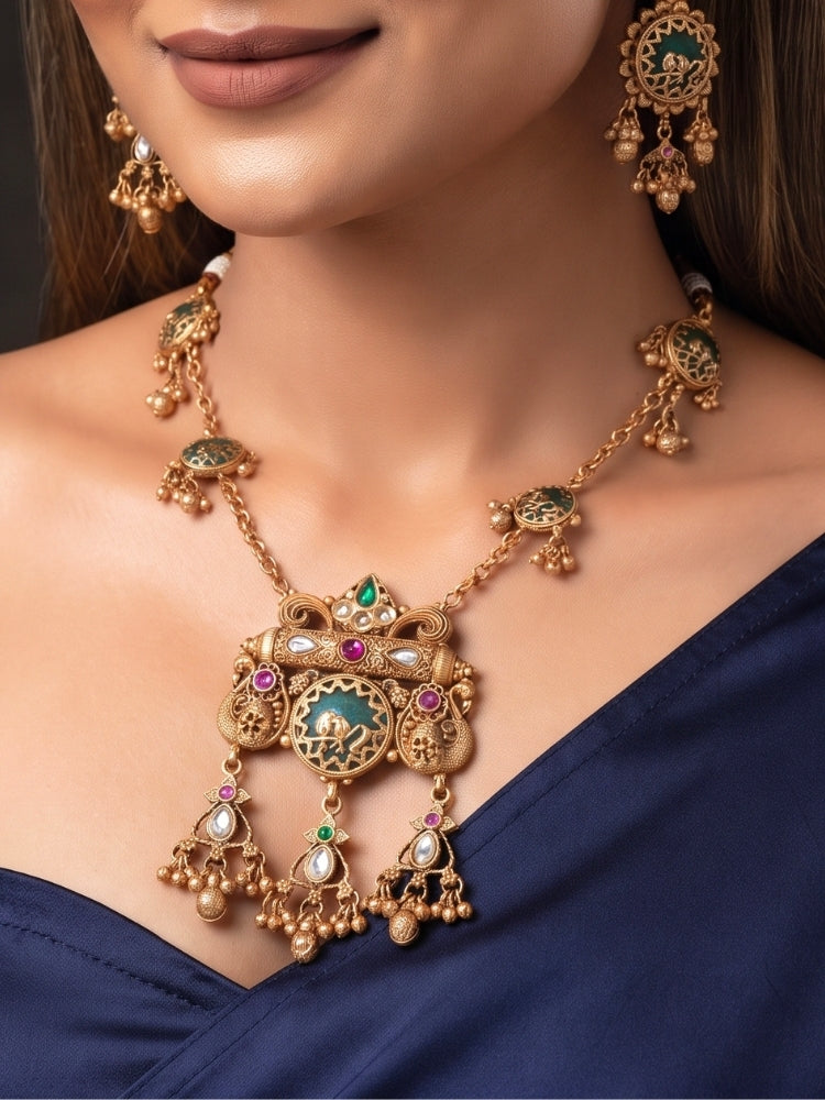 Close-up of amulet-bar pendant with Kundan, pink and green stones and ghungroo drops