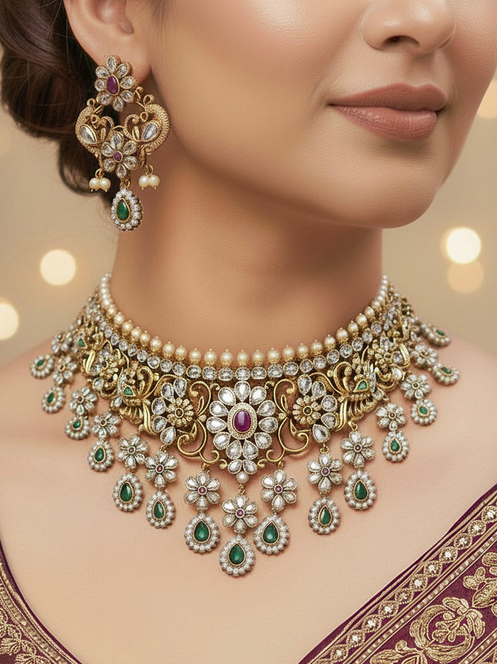 Woman wearing a gold American Diamond choker necklace set with matching earrings